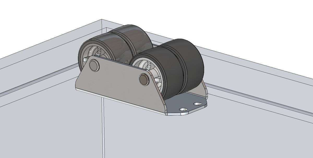 Zwei KARWEG 40-mm-Kastenbockrollen mit weicher Lauffläche auf Metall über einer Glasscheibe.